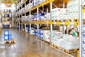 Long rack in warehouse with chemical liquids